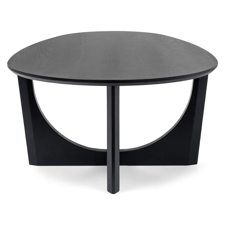 NORDI Coffee Table with sculpted base and natural wood grain in a modern living room