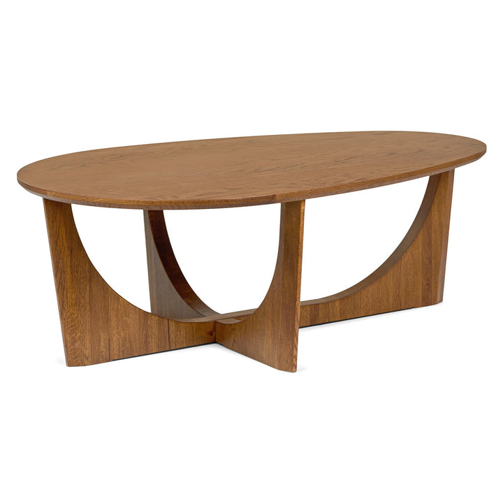 NORDI Coffee Table with sculpted base and natural wood grain in a modern living room