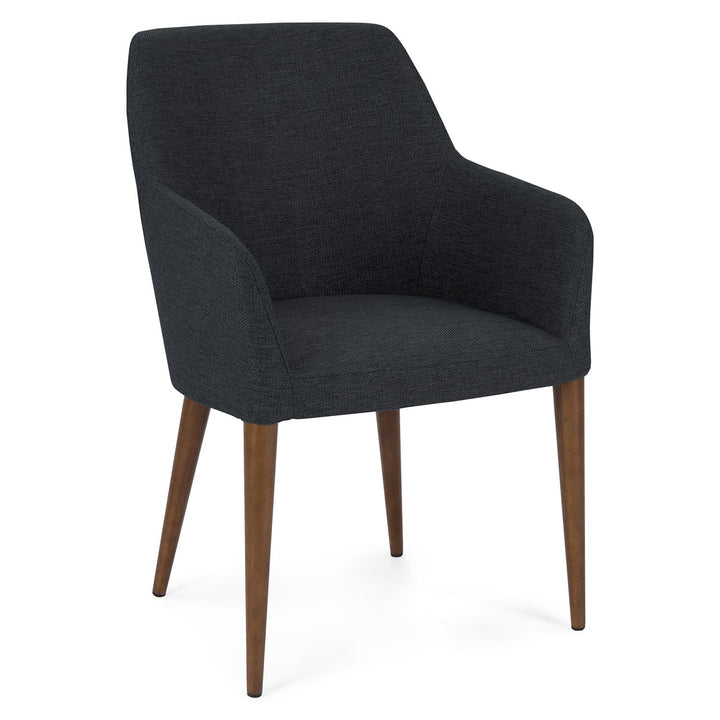 Navi Dining Chair in a modern dining room with walnut legs and upholstered seating