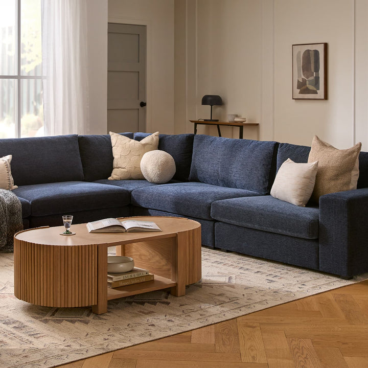 Nova Storage Coffee Table with open fluted doors revealing hidden compartments