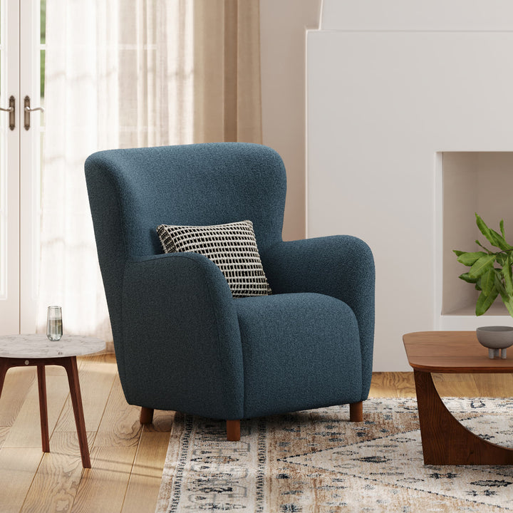 Nyx Lounge Chair in oatmeal bouclé with high backrest, two chairs facing a home theater screen