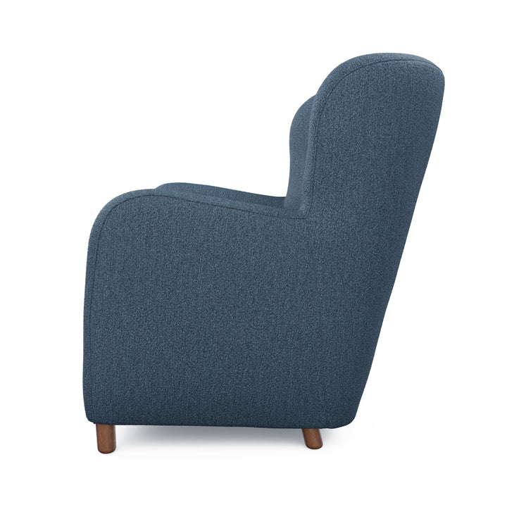 Nyx Lounge Chair in oatmeal bouclé with high backrest, two chairs facing a home theater screen
