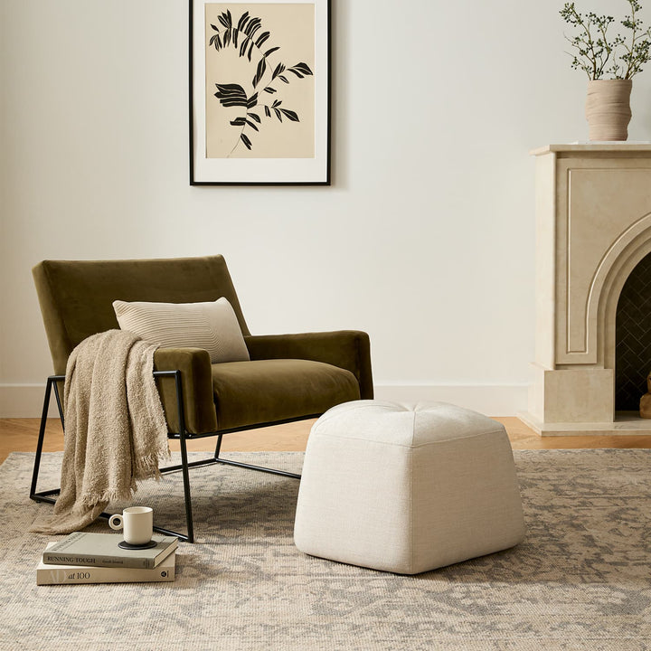 Ondine Green Velvet Lounge Chair in emerald with gold legs in a modern loft setting