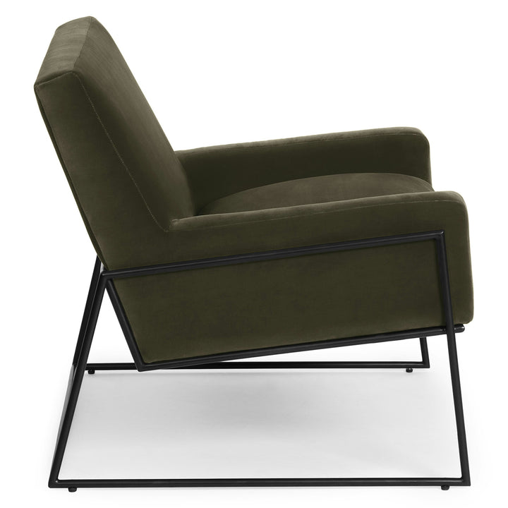Ondine Green Velvet Lounge Chair in emerald with gold legs in a modern loft setting