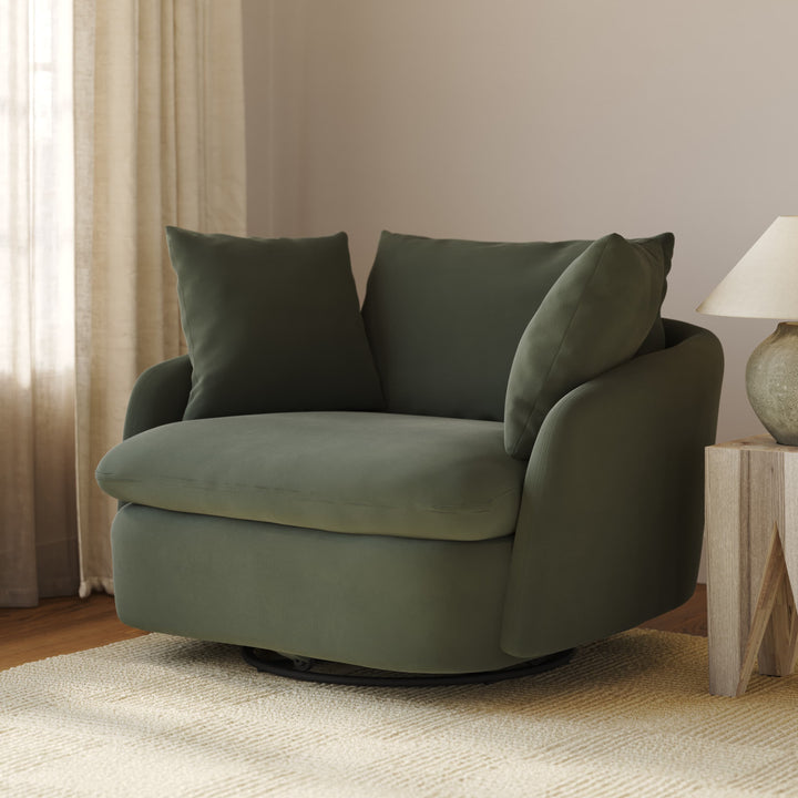 Orion Velvet Swivel Lounge Chair in deep green velvet rotating in modern living room