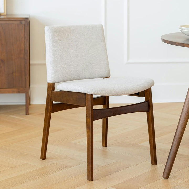 Pair of Lyra Dining Chairs in a mid-century modern dining room with textured upholstery