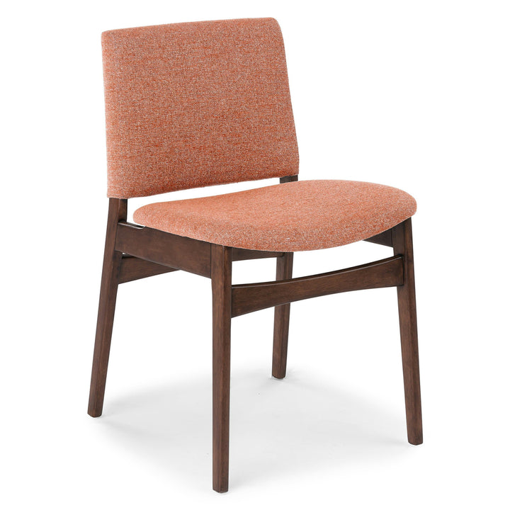 Pair of Lyra Dining Chairs in a mid-century modern dining room with textured upholstery