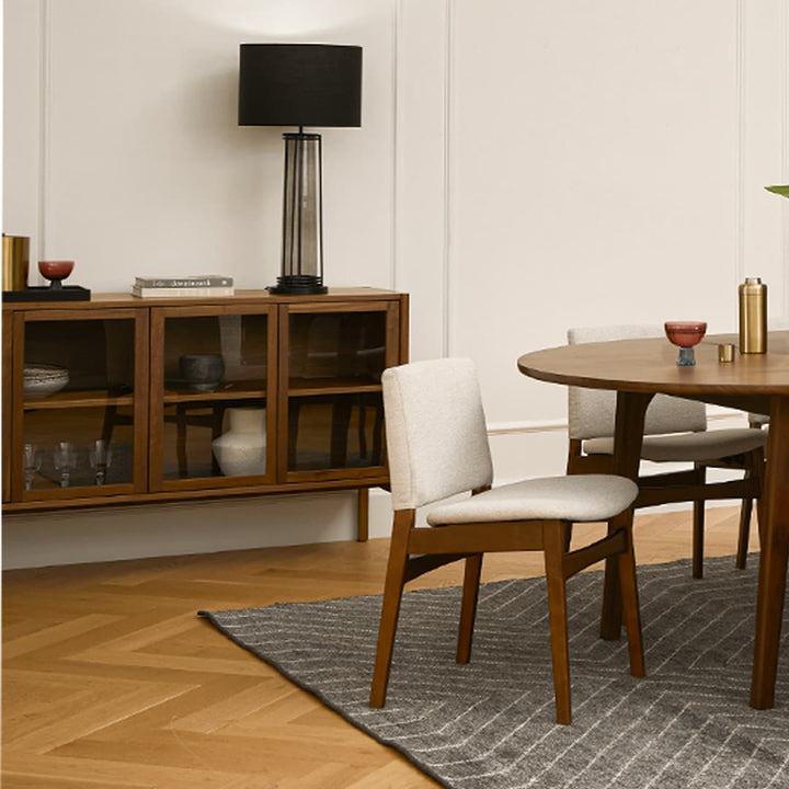 Pair of Lyra Dining Chairs in a mid-century modern dining room with textured upholstery
