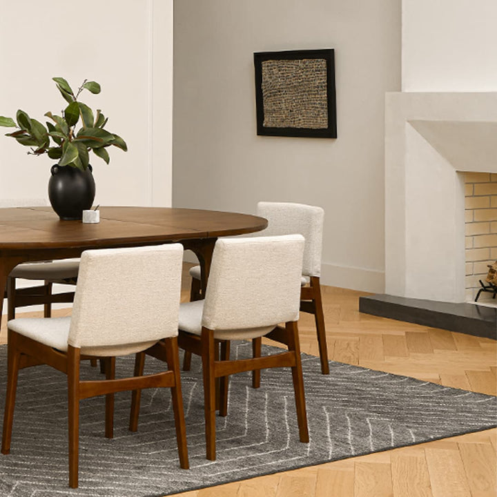 Pair of Lyra Dining Chairs in a mid-century modern dining room with textured upholstery