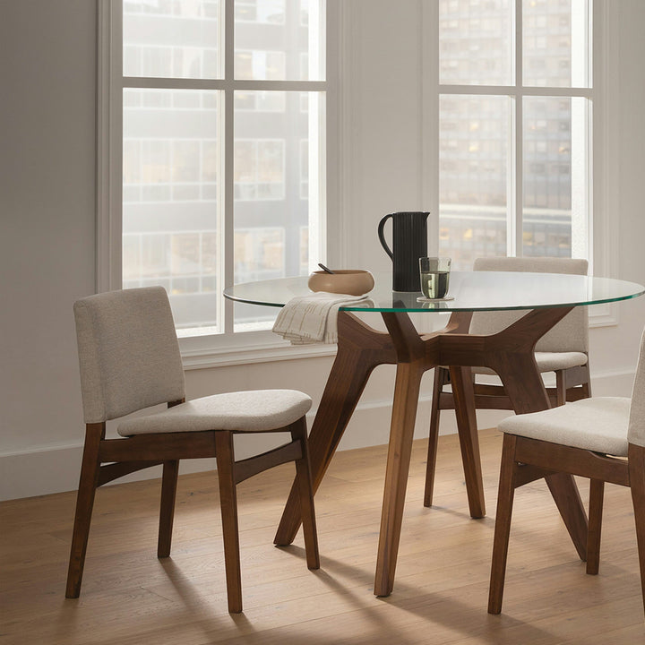 Pair of Lyra Dining Chairs in a mid-century modern dining room with textured upholstery