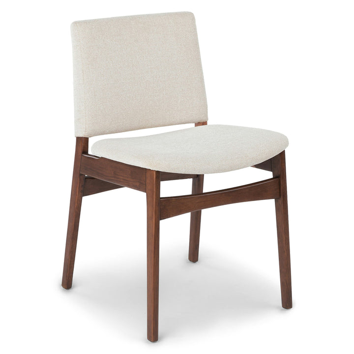 Pair of Lyra Dining Chairs in a mid-century modern dining room with textured upholstery