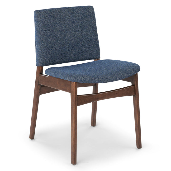 Pair of Lyra Dining Chairs in a mid-century modern dining room with textured upholstery