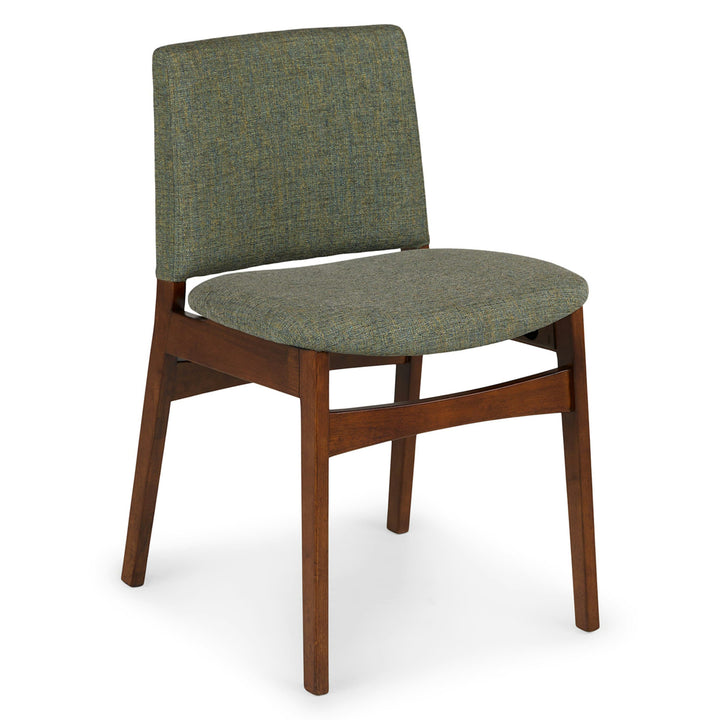 Pair of Lyra Dining Chairs in a mid-century modern dining room with textured upholstery