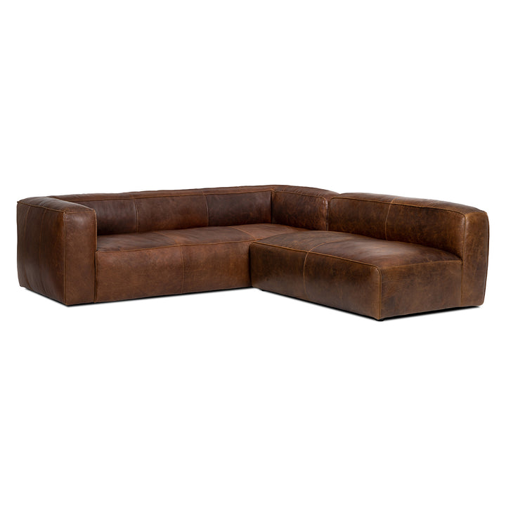Pembroke Leather Sectional in rawhide tan with laptop in home office setting