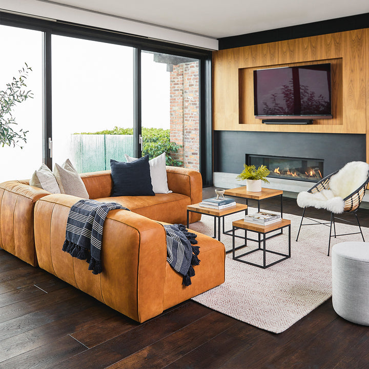 Pembroke Leather Sectional in rawhide tan with laptop in home office setting