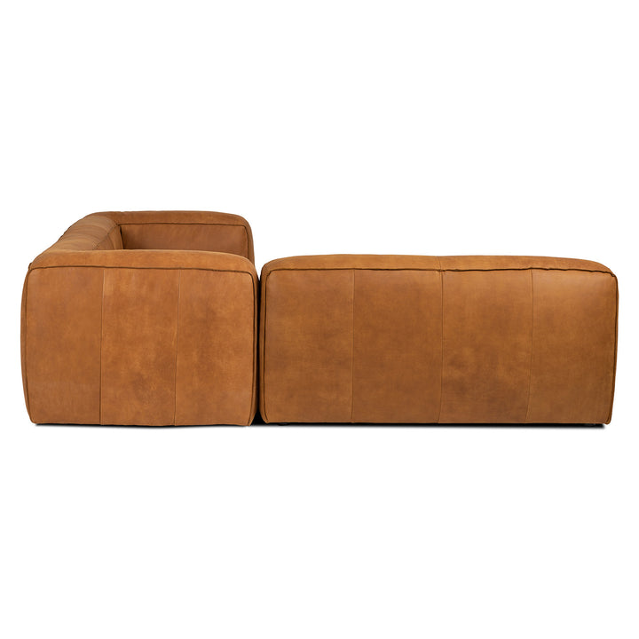 Pembroke Leather Sectional in rawhide tan with laptop in home office setting