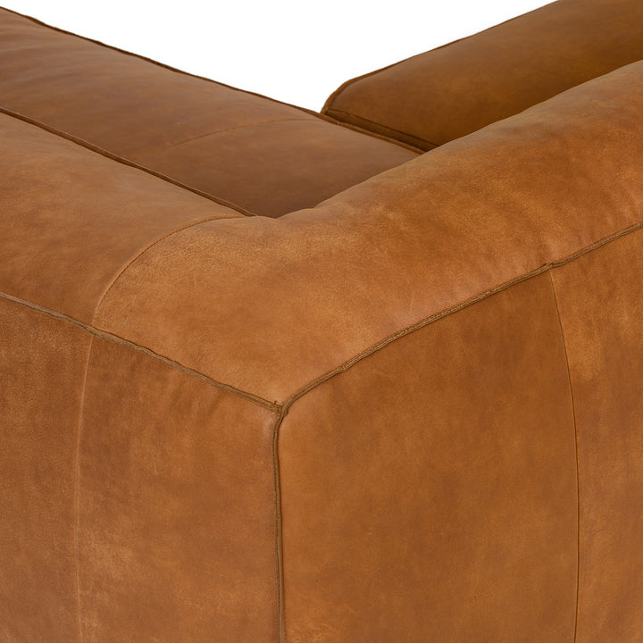 Pembroke Leather Sectional in rawhide tan with laptop in home office setting
