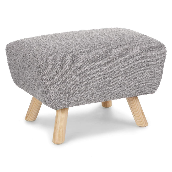 Polnatt Ottoman with bouclé upholstery and wood legs in a Scandinavian-style living room