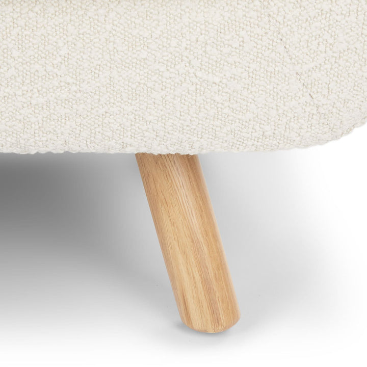 Santorini bouclé lounge chair in emerald green with curved wood frame in modern living room