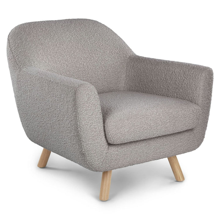 Santorini bouclé lounge chair in emerald green with curved wood frame in modern living room