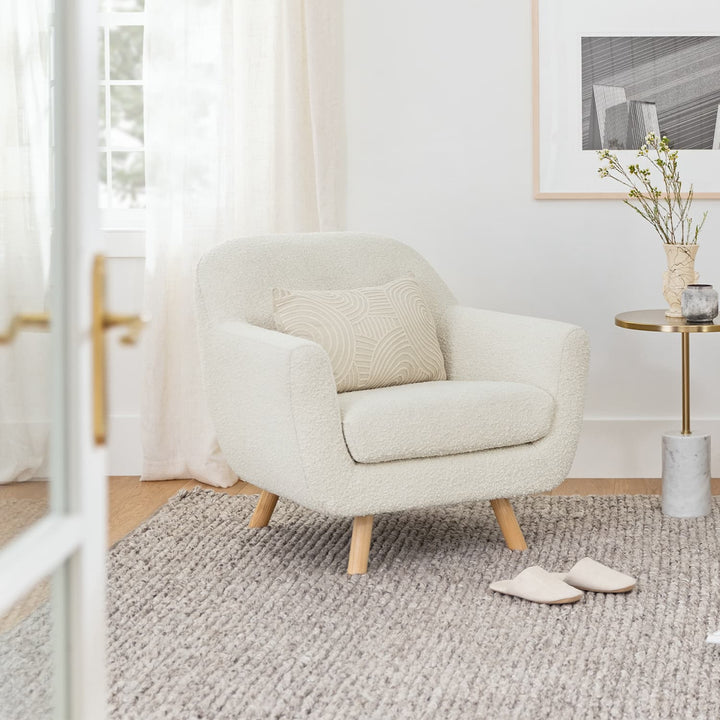 Santorini bouclé lounge chair in emerald green with curved wood frame in modern living room