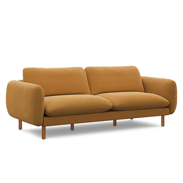 Saunders beige bouclé sofa with reversible cushions in Scandinavian-style family room