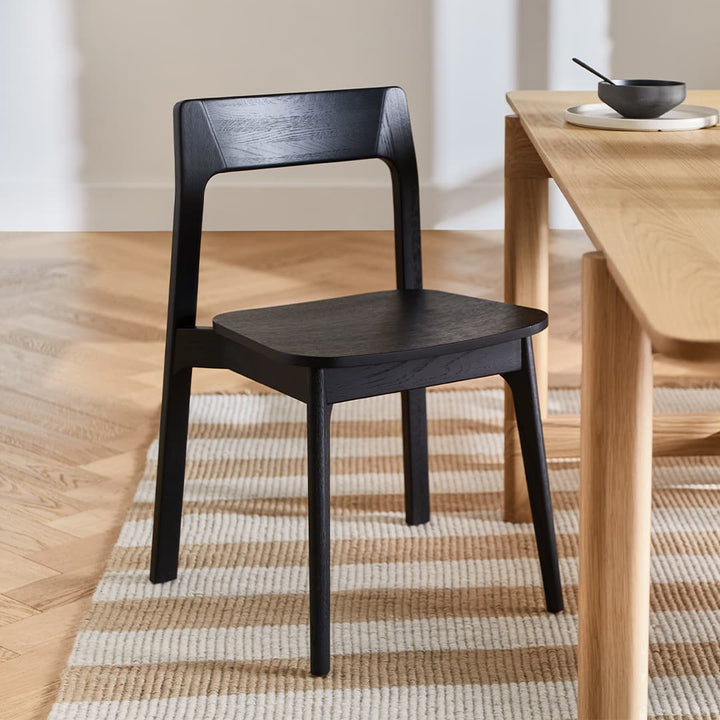 Selene Dining Chairs in a modern dining room with bentwood design and stackable feature