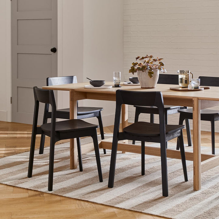 Selene Dining Chairs in a modern dining room with bentwood design and stackable feature