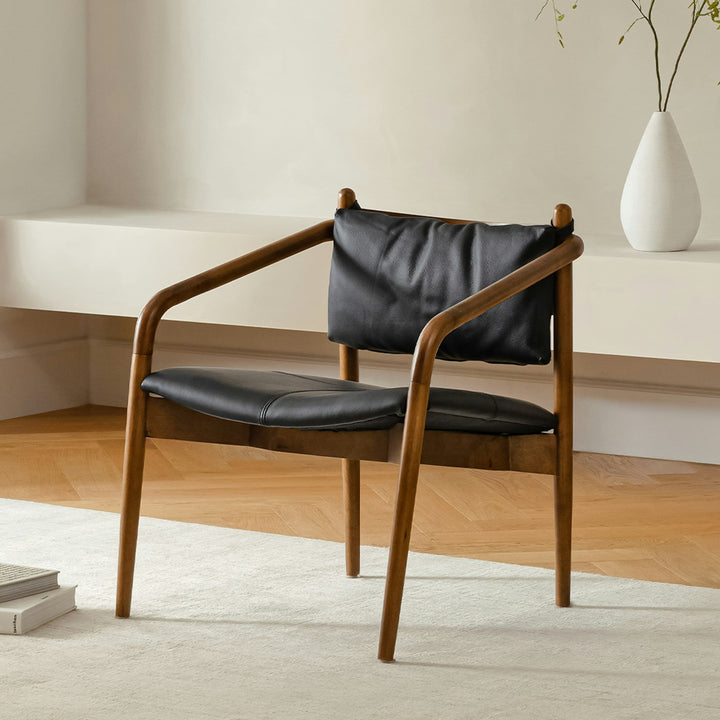 Solstice Leather Lounge Chair in tan patina leather with walnut legs in mid-century living room