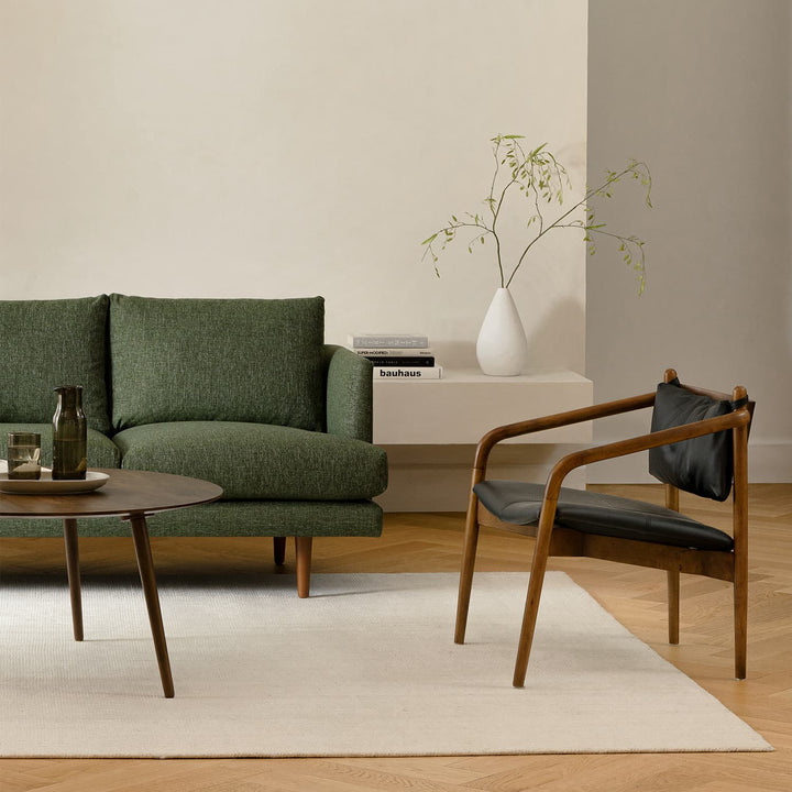 Solstice Leather Lounge Chair in tan patina leather with walnut legs in mid-century living room