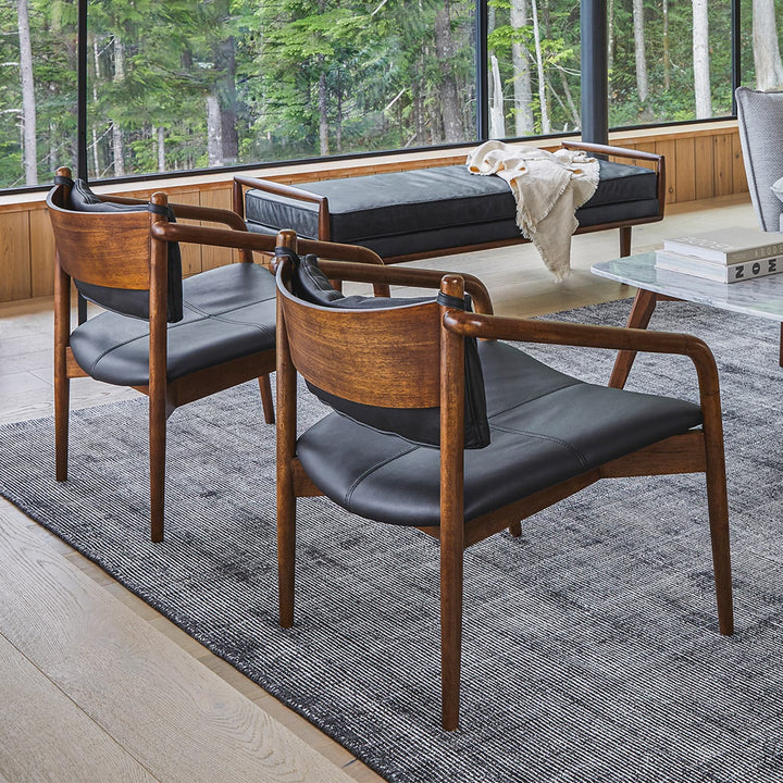 Solstice Leather Lounge Chair in tan patina leather with walnut legs in mid-century living room