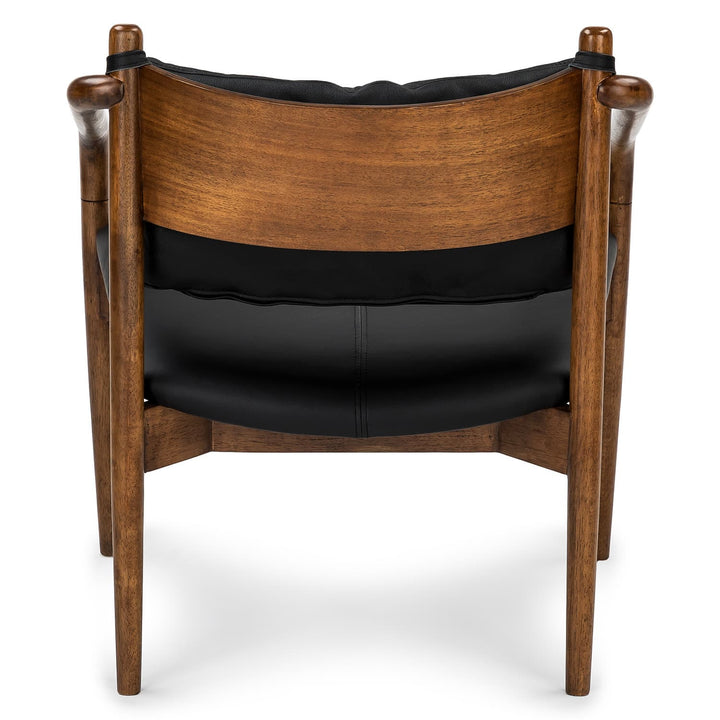 Solstice Leather Lounge Chair in tan patina leather with walnut legs in mid-century living room