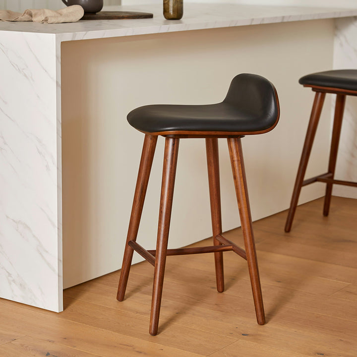 Stria Leather Counter Stool in a mid-century modern kitchen with tapered legs and Toscana leather seat