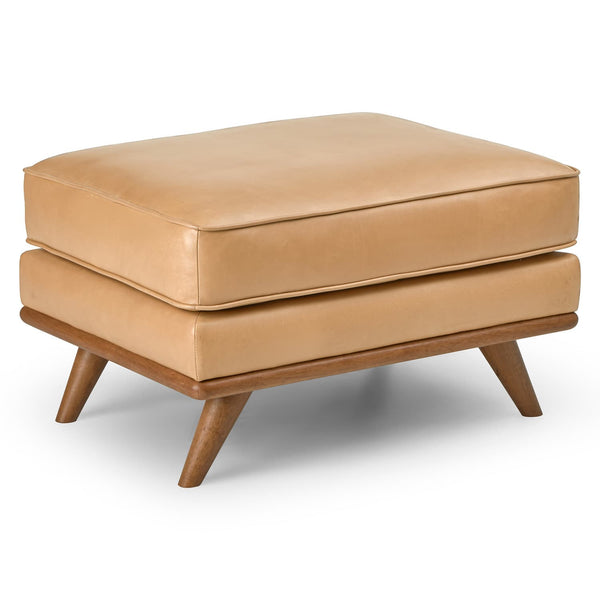 Svartur Leather Ottoman in a mid-century modern living room with aniline leather and wood legs