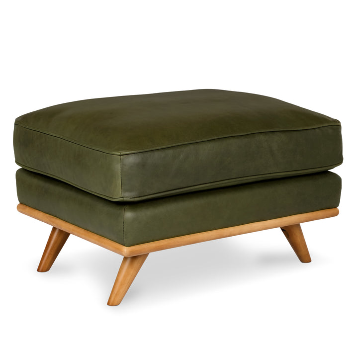 Svartur Leather Ottoman in a mid-century modern living room with aniline leather and wood legs
