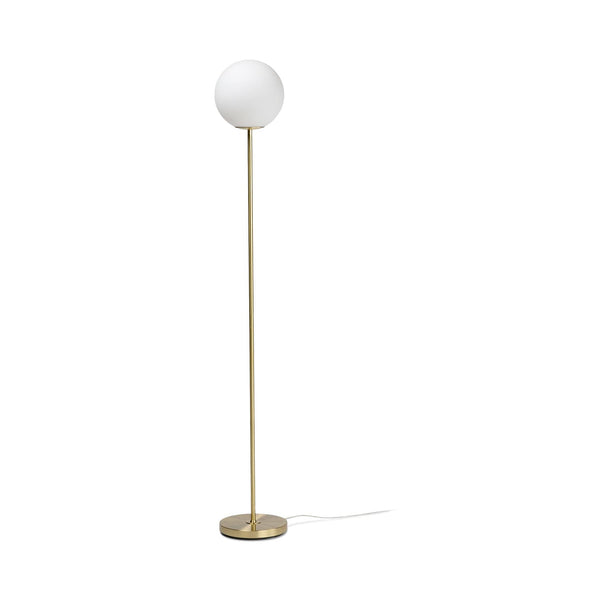 Svelte Floor Lamp with hand-blown frosted glass shade and metal base in a modern living room