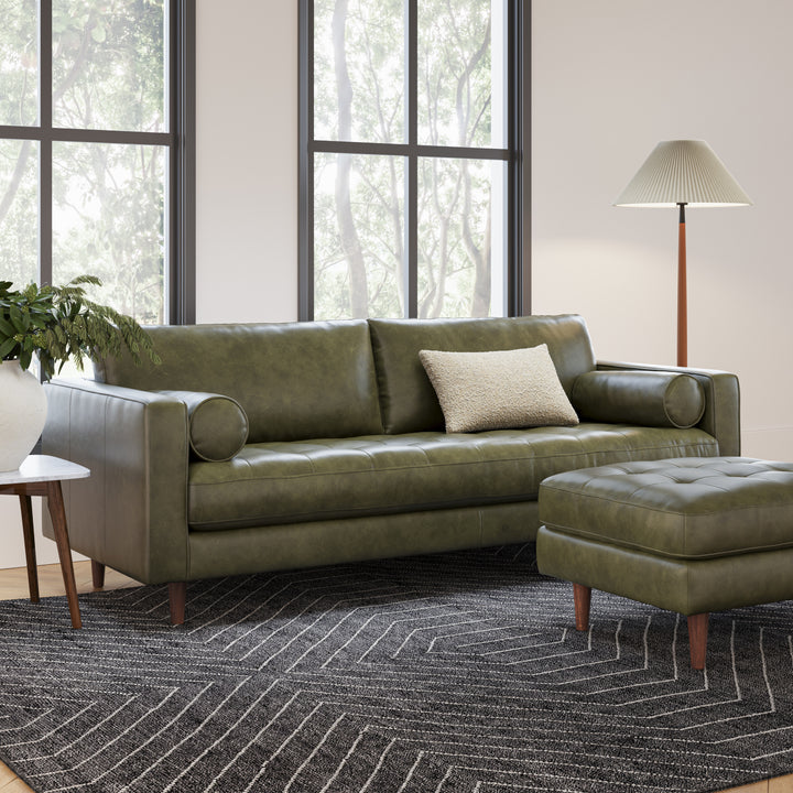 Svening Tufted Green leather sofa with bolster pillows in bohemian-style living room