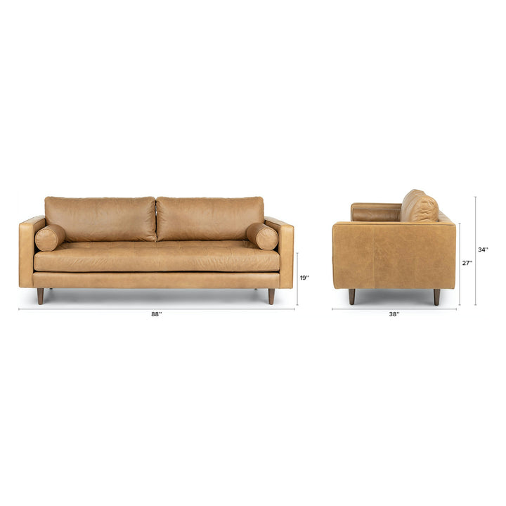 Svening Tufted Tan leather sofa with bolster pillows in bohemian-style living room