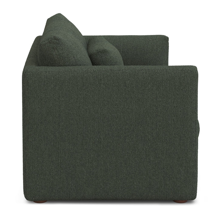 Sylph Sleeper Lounge Chair in green fabric, converted to bed mode in studio apartment