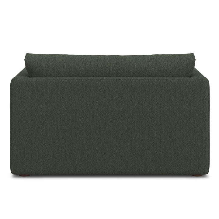 Sylph Sleeper Lounge Chair in green fabric, converted to bed mode in studio apartment