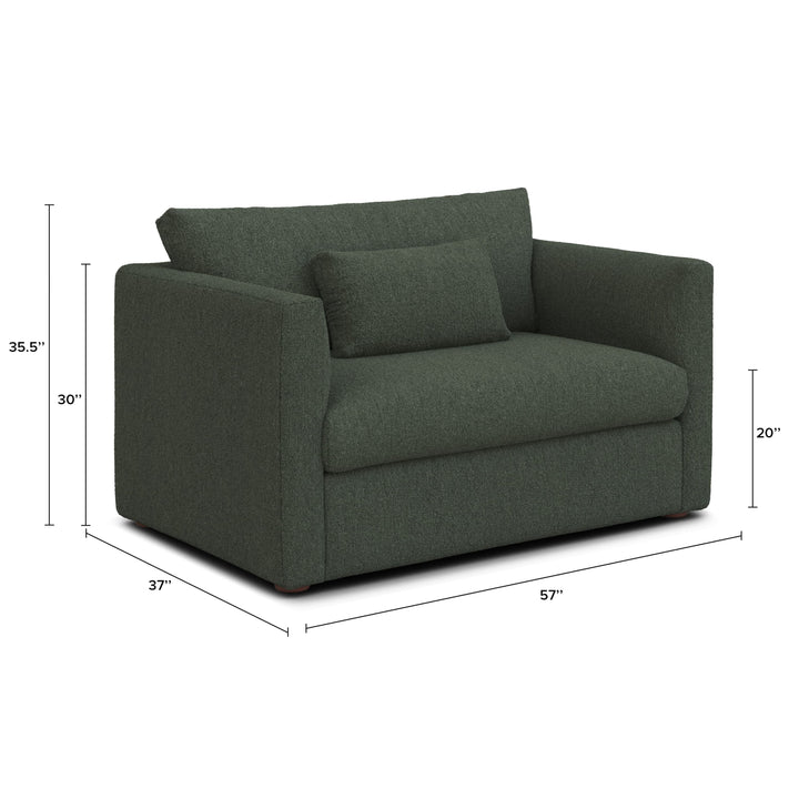 Sylph Sleeper Lounge Chair in green fabric, converted to bed mode in studio apartment