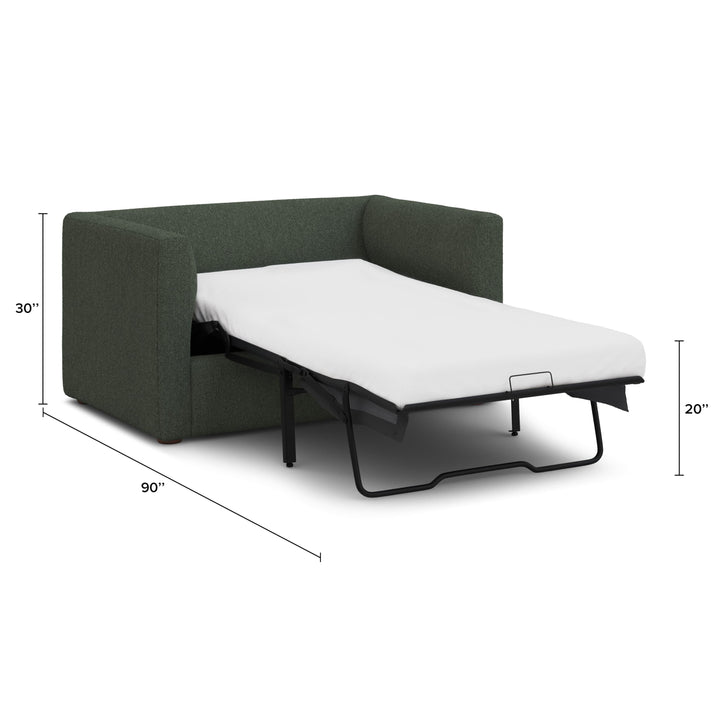Sylph Sleeper Lounge Chair in green fabric, converted to bed mode in studio apartment