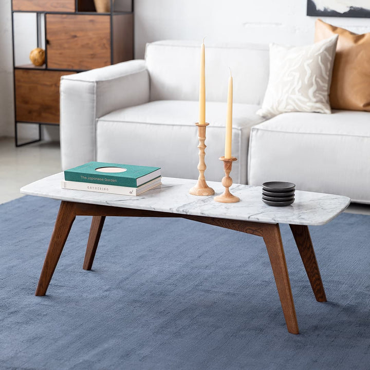 VARDO Marble Coffee Table in a modern living room setting, showcasing polished marble top and solid wood legs