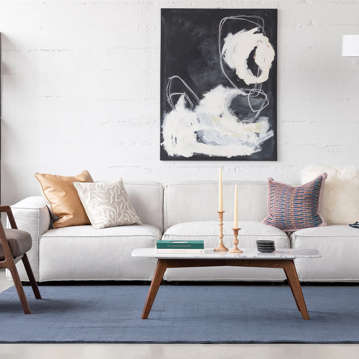 VARDO Marble Coffee Table in a modern living room setting, showcasing polished marble top and solid wood legs