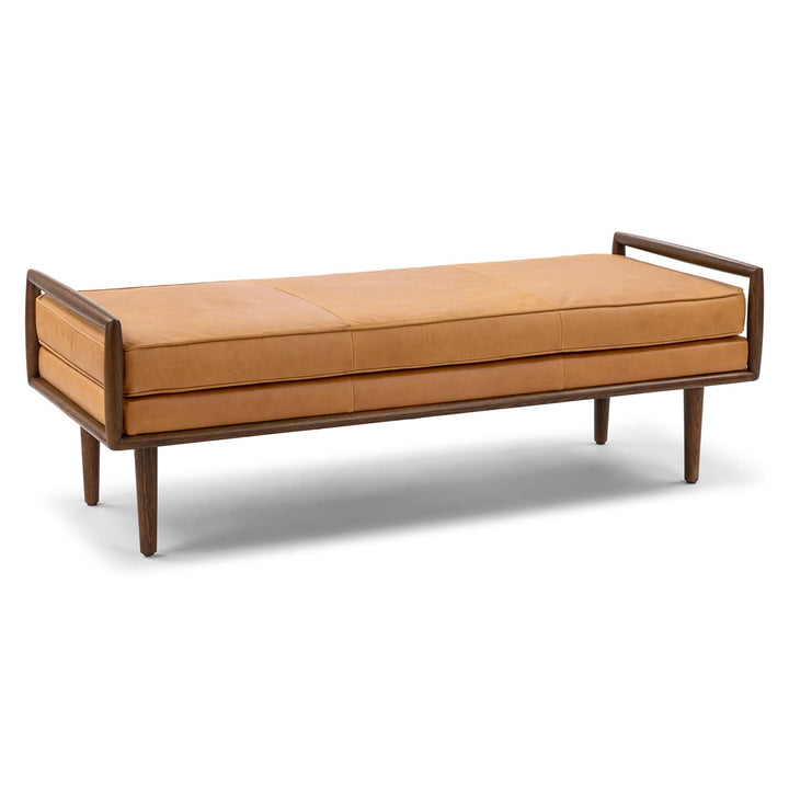 Vatn Leather Bench in a mid-century modern living room with walnut arms and tapered legs