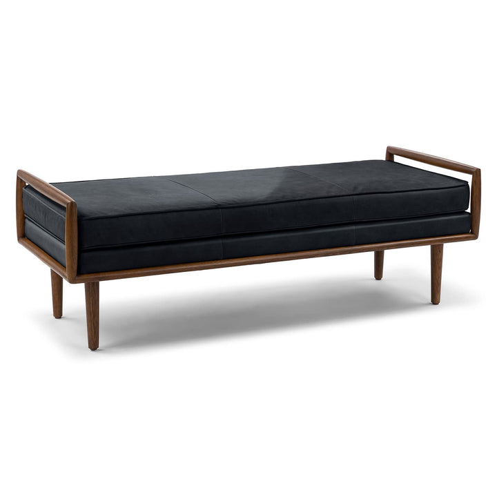 Vatn Leather Bench in a mid-century modern living room with walnut arms and tapered legs