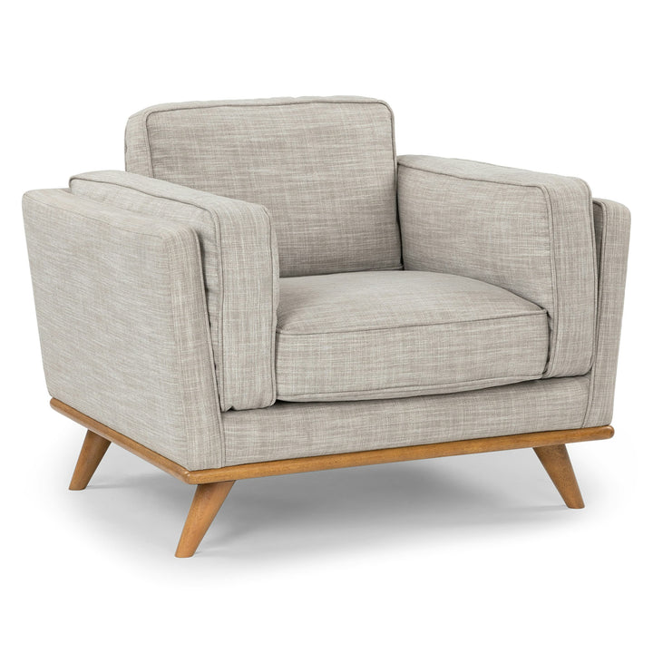 Ventura Lounge Chair in oat bouclé fabric with plush cushions, placed by a sunny window with coffee mug on side table