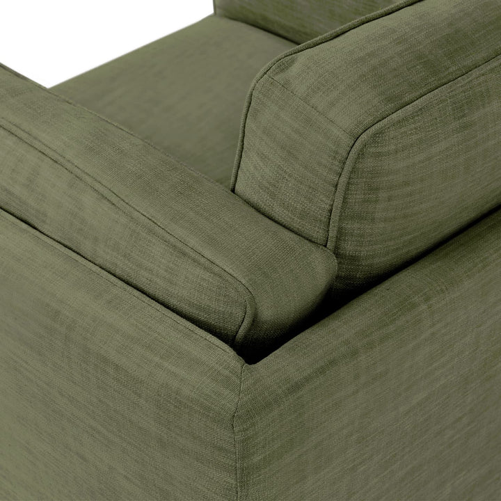 Ventura Lounge Chair in oat bouclé fabric with plush cushions, placed by a sunny window with coffee mug on side table