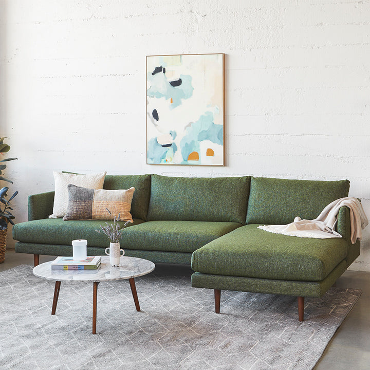 Winters Right green sectional with tapered legs in mid-century modern loft