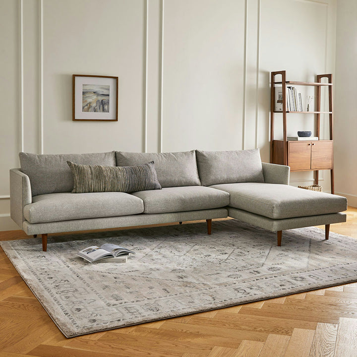Winters Right green sectional with tapered legs in mid-century modern loft